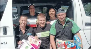  ?? Photo: KRIS DANDO ?? Driving force: From left, Kelly Belch from Johnsonvil­le Auto Repairs, Kiwi Community Assistance volunteer Hinetai Parekura, Kiwi Community Assistance co-founders Phil Davies and Tracy Wellington, and Stefan Ralph from Wasabi Air in the van the charity...