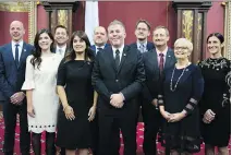  ?? JACQUES BOISSINOT/THE CANADIAN PRESS ?? Parti Québécois interim leader Pascal Berube and his caucus after Friday’s swearing in ceremony at the National Assembly in Quebec City. From left, Joel Arseneau, Catherine Fournier, Martin Ouellet, Veronique Hivon, Harold Lebel, Bérubé, Sylvain Gaudreault, Sylvain Roy, Lorraine Richard and Megan Perry Melancon.