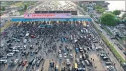  ?? (AFP) ?? An aerial view shows protesters gathering at the Lekki toll gate in Lagos, recently during a demonstrat­ion to protest against police brutality and scrapping of Special Anti-Robbery Squad (SARS).