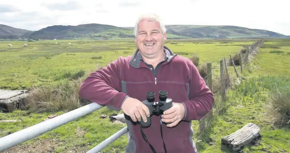  ?? Robert Parry Jones ?? > Alun Wyn Evans of Penllyn Farm, Tywyn, won a RSPB Nature of Farming award for his farm’s wetland areas