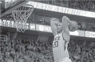  ?? THE ASSOCIATED PRESS ?? Utah Jazz forward Gordon Hayward goes up for a dunk against the Brooklyn Nets during a game in early March in Salt Lake City. Hayward, after spending the first seven seasons of his NBA career with the Jazz, is testing free agency and visited with the...