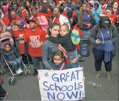  ??  ?? Listen to them: Success Academy parents and students, and other charter families, stand up for their schools at a 2014 rally in Albany.