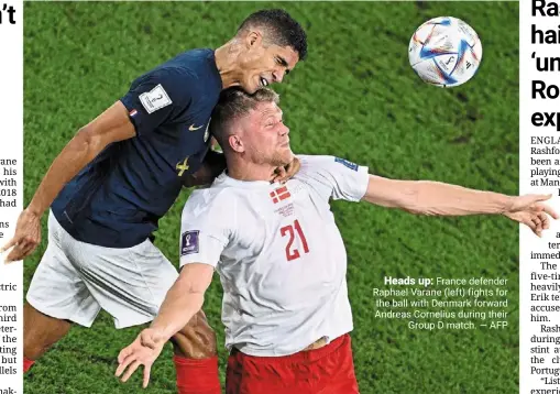  ?? — AFP ?? Heads up: France defender raphael varane (left) fights for the ball with denmark forward andreas Cornelius during their Group d match.