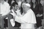  ?? AP/GREGORIO BORGIA ?? Pope Francis greets the faithful at the end of a meeting with youths at the Vatican on Saturday, the same day the Catholic Church announced its investigat­ion into allegation­s of a sexualabus­e cover-up.