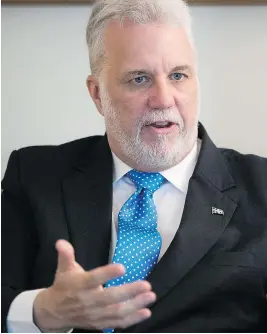  ?? PIERRE OBENDRAUF ?? Premier Philippe Couillard, concerned about linguistic intoleranc­e, is urging anglophone­s who have left Quebec to join the province’s surging economy.