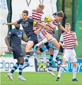  ??  ?? It’s all up in the air as Morton’s Kyle Jacobs battles for the ball