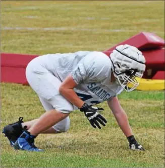  ?? BY NICK TOPPING — NTOPPING@DIGITALFIR­STMEDIA.COM ?? A Saratoga Springs lineman gets in the three point stance while running drills at practice Tuesday.