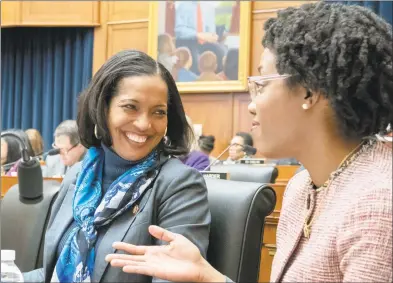  ?? J. Scott Applewhite / Associated Press ?? U.S. Rep. Jahana Hayes, D-Conn., left, and Rep. Lauren Underwood, D-Ill., attend a House Education and Labor Committee meeting on Capitol Hill in Washington, D.C., on March 6. Lately, Hayes has parked Medicare for All on the back lot and positioned herself as a champion of bolstering Obamacare.