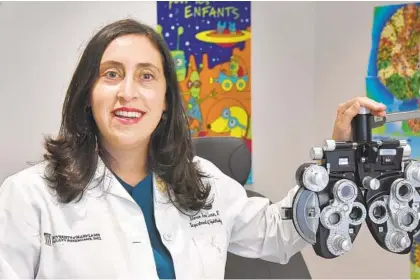  ?? AMY DAVIS/BALTIMORE SUN ?? Dr. M. Roni Levin, pediatric ophthalmol­ogist and assistant professor of ophthalmol­ogy and pediatrics at the University of Maryland School of Medicine, offers tips to help children avoid eye strain with increased screen time due to virtual learning on Sept. 30.