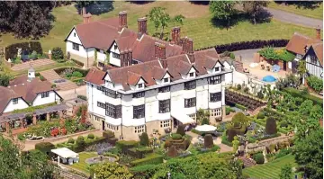  ??  ?? Grand: Rod Stewart and wife Penny, below, have slashed the price of Wood House