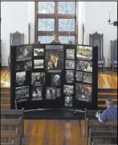  ?? Kathy Kmonicek The Associated Press ?? Jeremiah Chapman of Hillsborou­gh, N.C., sits in a pew Wednesday inside the chapel at the Billy Graham Training Center to view a memorial display in honor of Graham in Asheville, N.C.