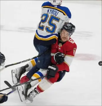  ?? Marta Lavandier/Associated Press ?? Florida defenseman Brandon Montour, right, would seem to have got the worst of this collision with St. Louis’ Jordan Kyrou Thursday night in Sunrise, Fla.