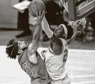  ?? Ricardo B. Brazziell / Associated Press ?? Texas forward Kai Jones, right, blocks UT-RIO Grande Valley’s Uche Dibiamaka during the second half. Jones finished with 14 points on 6-of-6 shooting with eight rebounds.