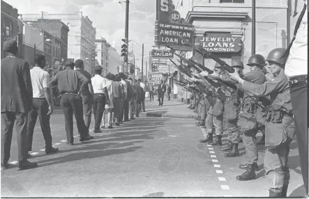  ?? BARNEY SELLERS / THE COMMERCIAL APPEAL ?? March 29, 1968: The daily sanitation strike marches resumed, one day after rioting left Main and Beale littered with bricks and broken glass and dappled with blood.