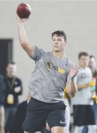  ?? Shannon Broderick, Laramie Boomerang ?? Josh Allen, throwing Friday at Wyoming’s indoor practice facility, had an impressive pro-day workout that drew representa­tives from 17 NFL teams to Laramie. They included the Browns, who have the No. 1 pick in the league’s April 26-28 draft.