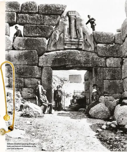  ??  ?? Wilhelm Dörpfeld (peeking through a hole) and Heinrich Schliemann at the Lion Gate at Mycene