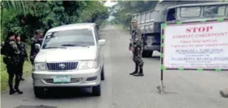  ??  ?? A COMELEC checkpoint manned by soldiers in the Philippine­s. (Cebu Examiner Photo Geonarri Solmerano)