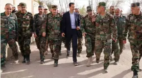  ?? (SalamPix/Abaca Press/TNS) ?? SYRIAN PRESIDENT Bashar al-Assad visits with regime forces in Eastern Ghouta last month.