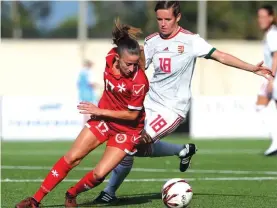  ??  ?? Brenda Borg (L) twists away from the close challenge of Szabina Talosi (R) Photo: Domenic Aquilina