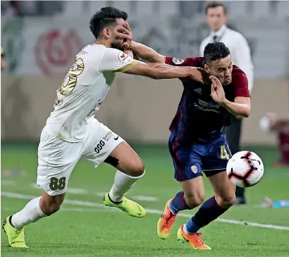  ??  ?? Al Wahda’s Leonardo de Sousa (right) vies for the ball against Shabab Al Ahli’s Majed Hassan Ahmed. —