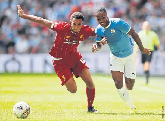  ??  ?? Liverpool’s Trent Alexander-Arnold, left, vies with Manchester City’s Raheem Sterling during the Community Shield match.