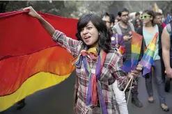  ??  ?? NEW DELHI: A participan­t holds a rainbow flag during a gay pride parade in New Delhi yesterday. Hundreds of gay rights activists danced to drum beats and held colorful balloons as they marched celebratin­g what they call the diversity of gender and...