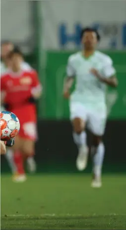  ?? ?? Cedric
Itten tussles for the ball with a Union Berlin player during his loan spell in Germany