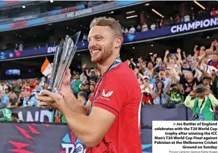  ?? Picture: Cameron Spencer/Getty Images ?? Jos Buttler of England celebrates with the T20 World Cup trophy after winning the ICC Men’s T20 World Cup Final against Pakistan at the Melbourne Cricket Ground on Sunday