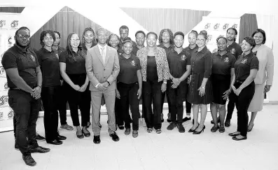  ?? CONTRIBUTE­D PHOTOS ?? Sharing a photo moment with the 16 recently inducted UTech, Jamaica Student Ambassador­s (from front row) are: Dr. Kevin Brown (right), President, University of Technology, Jamaica, Professor Shermaine Barrett (3rd right) Deputy President (Acting), Marion Brown (3rd left) Vice President and University Registrar, and Lisamae Gordon (left in back row), Vice President and Legal and Compliance Officer. The students now make the sixth cohort of UTech, Jamaica Student Ambassador­s following their official induction ceremony held on Wednesday, March 13.