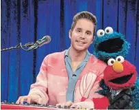  ?? RICHARD TERMINE THE ASSOCIATED PRESS ?? Actor Ben Platt with Cookie Monster and Elmo during a taping “The Not Too Late Show with Elmo” that started streaming on HBO Max on May 27.