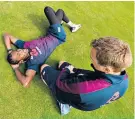  ??  ?? Full stretch: Jofra Archer is treated by England physio Craig de Weymarn