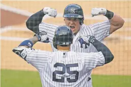 ?? GREGORY BULL/ASSOCIATED PRESS FILE PHOTO ?? The Yankees’ Luke Voit, top, celebrates with teammate Gleyber Torres after Voit hit a solo home run against the Rays on Thursday in Game 4 of the AL Division Series in San Diego.