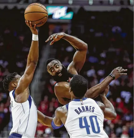  ?? Brett Coomer / Staff photograph­er ?? Mavericks guard Dennis Smith Jr., left, blocks a pass by Rockets guard James Harden on Wednesday night at Toyota Center.