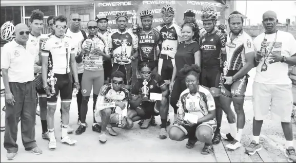  ??  ?? Prize winners of the seventh annual PowerAde 50-mile road race pose for a photo yesterday at West Demerara.