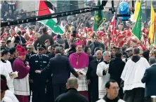  ?? AFP/File ?? Archbishop Pierbattis­ta Pizzaballa, center, the Latin Patriarch of Jerusalem, takes part in the Christmas Eve celebratio­ns in Bethlehem.