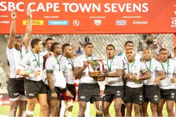  ?? — AFP photo ?? Fiji players celebrate after winning the HSBC World Rugby Sevens tournament at the end of the final match between United States and Fiji at the Cape Town Stadium in Cape Town.