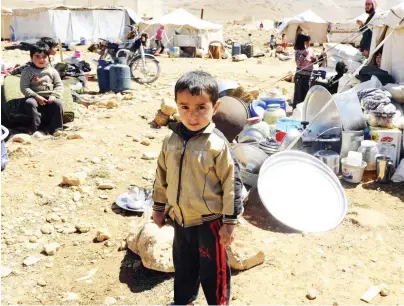  ??  ?? A young Syrian refugee in Lebanon. (Reuters)