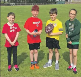  ??  ?? The winning St Columba’s inter-schools mile race team with their shield.