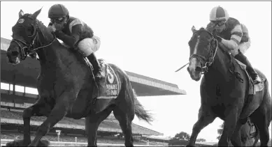  ?? CHELSEA DURAND/NYRA ?? Catholic Boy (left) wins the Pennine Ridge over Analyze It on June 2 at Belmont Park.