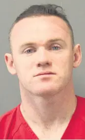  ??  ?? MUG Wayne Rooney was pictured looking bleary-eyed