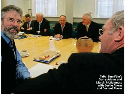  ?? ?? Talks: Sinn Féin’s Gerry Adams and Martin McGuinness with Bertie Ahern and Dermot Ahern