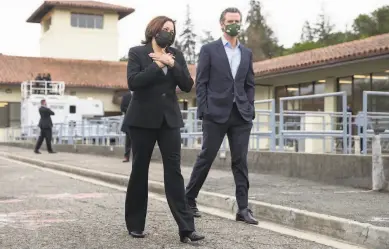  ?? Photos by Jessica Christian / The Chronicle ?? Vice President Kamala Harris accompanie­s Gov. Gavin Newsom on a tour of a water treatment plant in Oakland. Harris was in town to tout the Biden administra­tion’s $2 trillion infrastruc­ture plan.