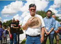  ??  ?? Lange Kimball joins others in prayer at Monday’s Memorial Day ceremony at the Houston National Cemetery.