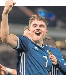  ??  ?? James Forrest enjoys one of his Scotland goals