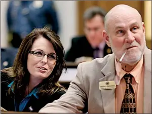  ?? AP/DANNY JOHNSTON ?? State Rep. Julie Mayberry, R-Hensley, speaks with Rep. Mark McElroy, D-Tillar, on Monday in the House chamber. Mayberry’s legislatio­n preventing the use of telemedici­ne by abortion providers passed the House, 83-4.