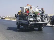  ??  ?? Syrians flee north from rebel-held Idlib province AFP