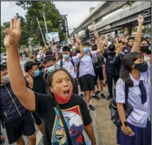  ?? ASSOCIATED PRESS ?? Pro-democracy protesters flash three-fingered salutes during a demonstrat­ion at Kaset intersecti­on in the suburbs of Bangkok, Thailand, Monday.