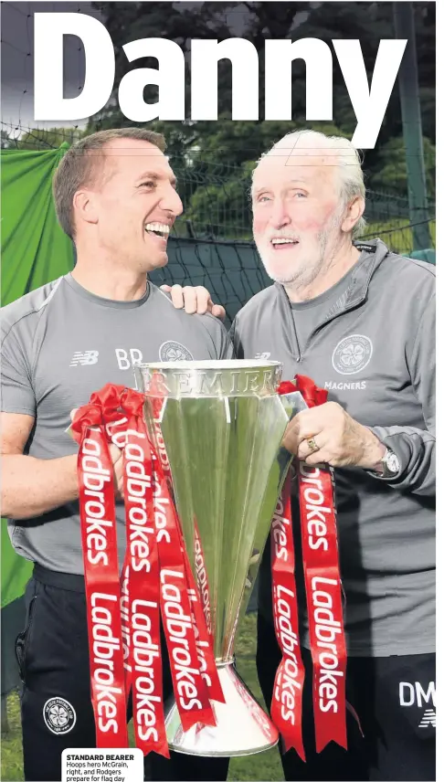  ??  ?? STANDARD BEARER Hoops hero McGrain, right, and Rodgers prepare for flag day