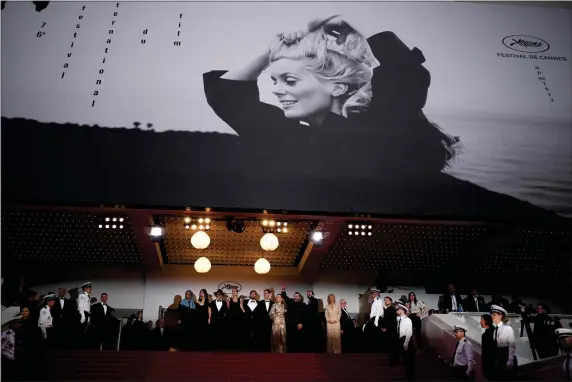  ?? DANIEL COLE — THE ASSOCIATED PRESS ?? Jury president Ruben Ostlund, center, poses with jury members upon arrival at the opening ceremony and the premiere of the film “Jeanne du Barry” at the 76th internatio­nal film festival, Cannes, southern France, on May 16, 2023.