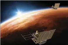  ??  ?? This illustrati­on made available by NASA on March 29 shows the twin Mars Cube One (MarCO) spacecraft flying over Mars with Earth and the sun in the distance. NASA/JPL-CALTECH VIA AP